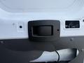 Close-up of a black handle mounted on the interior of a 2017 RAM Promaster door with wiring visible in the adjacent panel