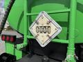 A 1996 Kenworth T800 truck featuring a diamond-shaped placard with the number 9000 displayed prominently on the rear