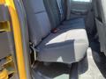 The image shows the back seat of a 2013 Chevrolet Silverado 1500 with black fabric upholstery and seatbelts in place