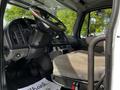 Interior of a 2012 Freightliner M2 106 showing the driver's seat dashboard steering wheel and control panel