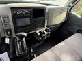Interior view of a 2014 International TerraStar showing the dashboard controls gear shift and seating area