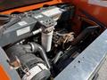 Image of a 2017 Gehl R105 engine compartment showcasing various components including a turbine and filters in a compact arrangement