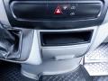 Interior dashboard of a 2016 Mercedes-Benz Sprinter showing control buttons and a storage compartment