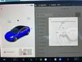 A blue 2019 Tesla Model 3 displayed on a touchscreen interface showing vehicle controls and settings