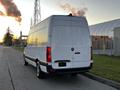 A 2019 Mercedes-Benz Sprinter van parked with its rear facing the camera showcasing its large cargo area and sleek design