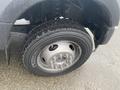 Close-up of a tire on a 2021 Ford F-550 showcasing the tread and wheel assembly