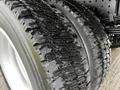 Close-up of a tire on a 2021 Mitsubishi FE showcasing tread patterns designed for traction and stability