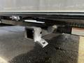 A hitch receiver mounted under a 2021 Grand Design Recreational 311BHS travel trailer