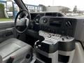 Interior view of a 2016 Ford Econoline showing the driver's seat dashboard controls and audio system