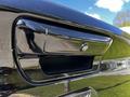 Close-up of the rear handle and backup camera of a 2019 RAM 1500 showing sleek black finish and modern design features