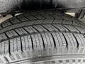 A close-up view of a tire from a 2023 Mercedes-Benz Sprinter showcasing its tread patterns and grooves