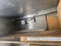 Interior view of a 2007 Morgan Olson Workhorse W42 featuring metal rails and wooden shelves for storage and organization of equipment and supplies