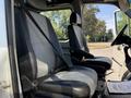 2007 Dodge Sprinter interior showing two front seats with seatbelts secured