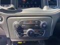 Dashboard controls of a 2019 Dodge Charger featuring buttons for volume mute climate control and air conditioning settings