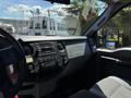 Interior view of a 2014 Ford F-250 SD showing the dashboard and steering wheel with controls and gauges