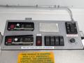 Control panel for a 2012 Ford Econoline E-450 featuring switches for lights and generator with labels for power and function indicators