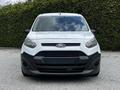 A white 2016 Ford Transit Connect with a black grille features a compact van design and is facing forward with no visible license plate