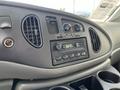Dashboard of a 2008 Ford Econoline featuring air vents a radio and controls for the vehicle's systems