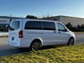 A white 2022 Mercedes-Benz Metris van is parked with its side profile visible showcasing sleek design and alloy wheels