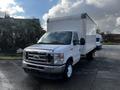 White 2021 Ford Econoline box truck with a closed cargo area and a silver front grille