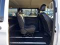 Interior of a 2022 Mercedes-Benz Metris showing rear seats in black leather material with adjustable tracks for easy movement