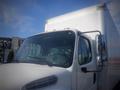 A 2016 Freightliner M2 106 Medium Duty truck with a white box cargo area and a large windshield