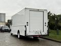 A white 2018 Ford E-450 box truck viewed from the rear with a smooth exterior and large cargo area