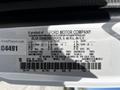 A 2009 Ford LCF 550 vehicle identification label detailing specifications such as weight ratings, tire sizes, and manufacturing information