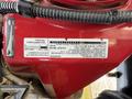 A red 2020 Ram 2500 showcasing its engine components and user information label