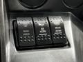 Three black control switches labeled Heated Mirror Air Horn and Rear Axle Low Ratio