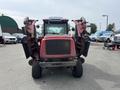 A red 2012 Toro Groundsmaster 5910 with two mowers attached on either side facing forward