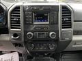 Dashboard of a 2017 Ford F-250 featuring a central display screen and various buttons for audio and climate control settings