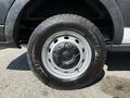 A close-up of a Goodyear Wrangler tire mounted on a 2022 Ford Transit showing detailed tread and silver rim elements