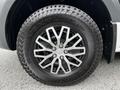 A close-up of a black and silver alloy wheel on a 2020 Mercedes-Benz Sprinter featuring a Kumho Roadventure A/T51 tire
