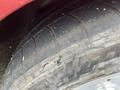 A close-up of a tire from a 1970 Chevrolet Corvette showing visible tread pattern and dirt on the rubber surface