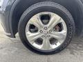 A close-up of a silver wheel on a 2015 Dodge Durango featuring a polished five-spoke design with a Goodyear Fortera tire mounted on it