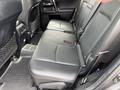 Rear seats of a 2021 Toyota 4Runner featuring black leather upholstery and seatbelt attachments