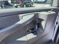 Interior door handle and control buttons of a 2012 Chevrolet Express van