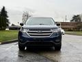 Front view of a blue 2017 Ford Edge with a chrome grille and headlights