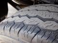 Close-up of a worn tire tread on a 2016 Mercedes-Benz Sprinter showing deep grooves and surface wear