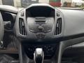 Interior dashboard of a 2014 Ford Transit Connect featuring controls for audio and climate settings