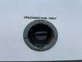 Fuel filler neck of a 2020 Chevrolet Express with a label indicating unleaded fuel only