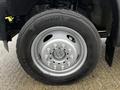 Close-up of a 2015 Ford F-550 wheel with a Continental tire featuring a silver rim and multiple silver bolts securing it