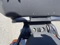 Close-up view of a 2022 Royal Enfield Himalayan motorcycle's rear seat and luggage rack with mounting brackets visible