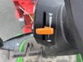 Close-up of a control lever on a 2014 John Deere 1585 Terrain Cut with an orange handle and a marked adjustment slider