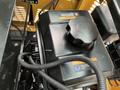 Close-up of the engine compartment of a 2024 AGT Industrial Yellow H13R Mini Excavator showing the black fuel tank cap and surrounding wires and components