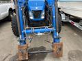 A blue 2016 New Holland T475 tractor with a front loader attachment and large tires