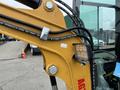 2024 AGT Industrial Yellow H13R Mini Excavator with hydraulic hoses and an attached work light visible on the arm of the machine
