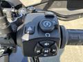 Close-up of the handlebar controls on a 2021 Harley-Davidson RA1250 S featuring buttons for mode settings and audio controls