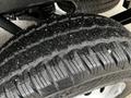 Close-up of a tire from a 2023 Ford Transit showcasing its tread pattern and rubber details